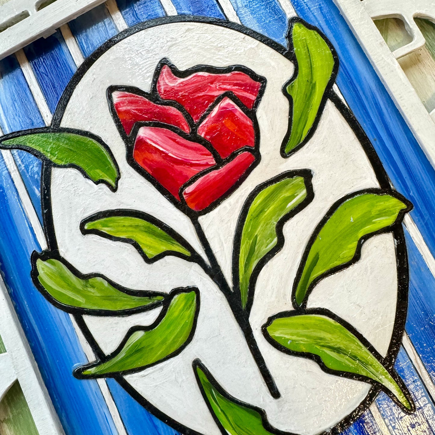 3D Red Rose artwork. A single rose stands out against a pristine white geometric trellis and sky-blue backdrop - a symbol of elegance and individuality. the stacked layers of birchwood panels creates unique shadows 