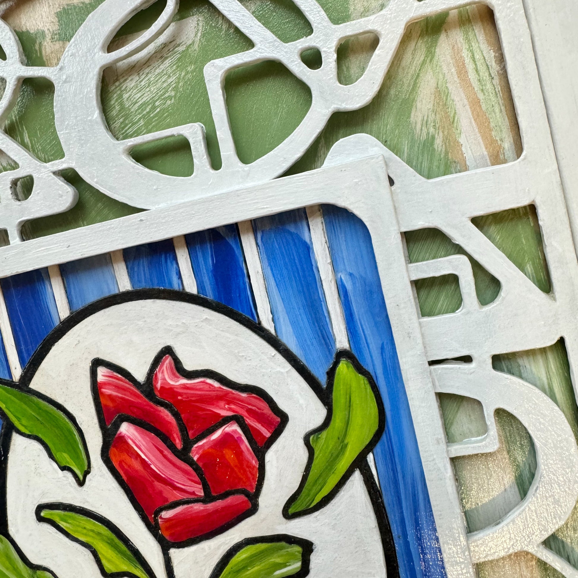 3D Red Rose artwork. A single rose stands out against a pristine white geometric trellis and sky-blue backdrop - a symbol of elegance and individuality. the stacked layers of birchwood panels creates unique shadows 