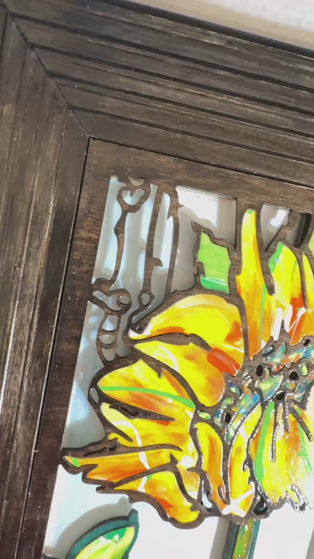 Sunflower inlaid mosaic 3D wood wall sculpture yellow flower with blue and green geometric abstract shapes in the background. video